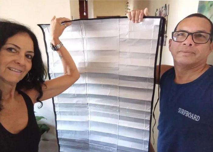 Casal transforma caixas de leite em mantas térmicas para pessoas em situação de rua no RJ