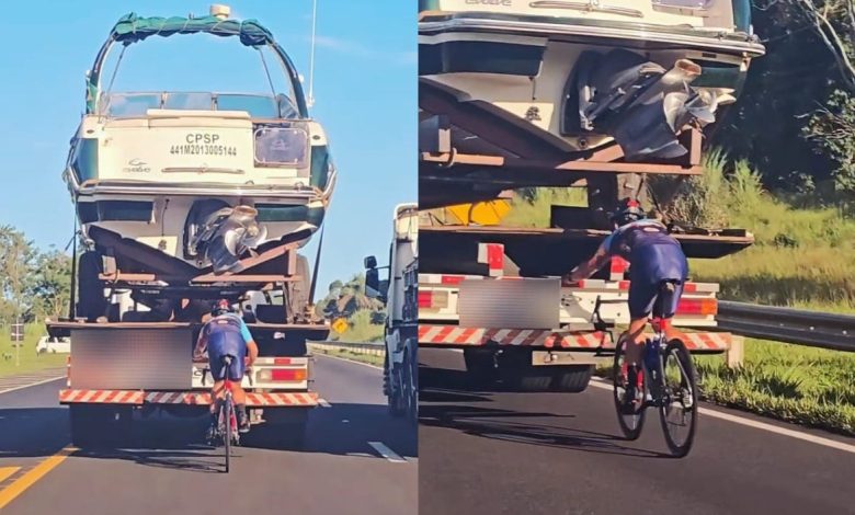 Manobra perigosa: ciclista é flagrado “colado” em caminhão com lancha em rodovia